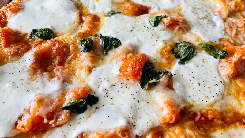 Why Cast Iron and a Little Steam Are the Closest Your Home Oven Will Ever Get to a Real Pizza Deck